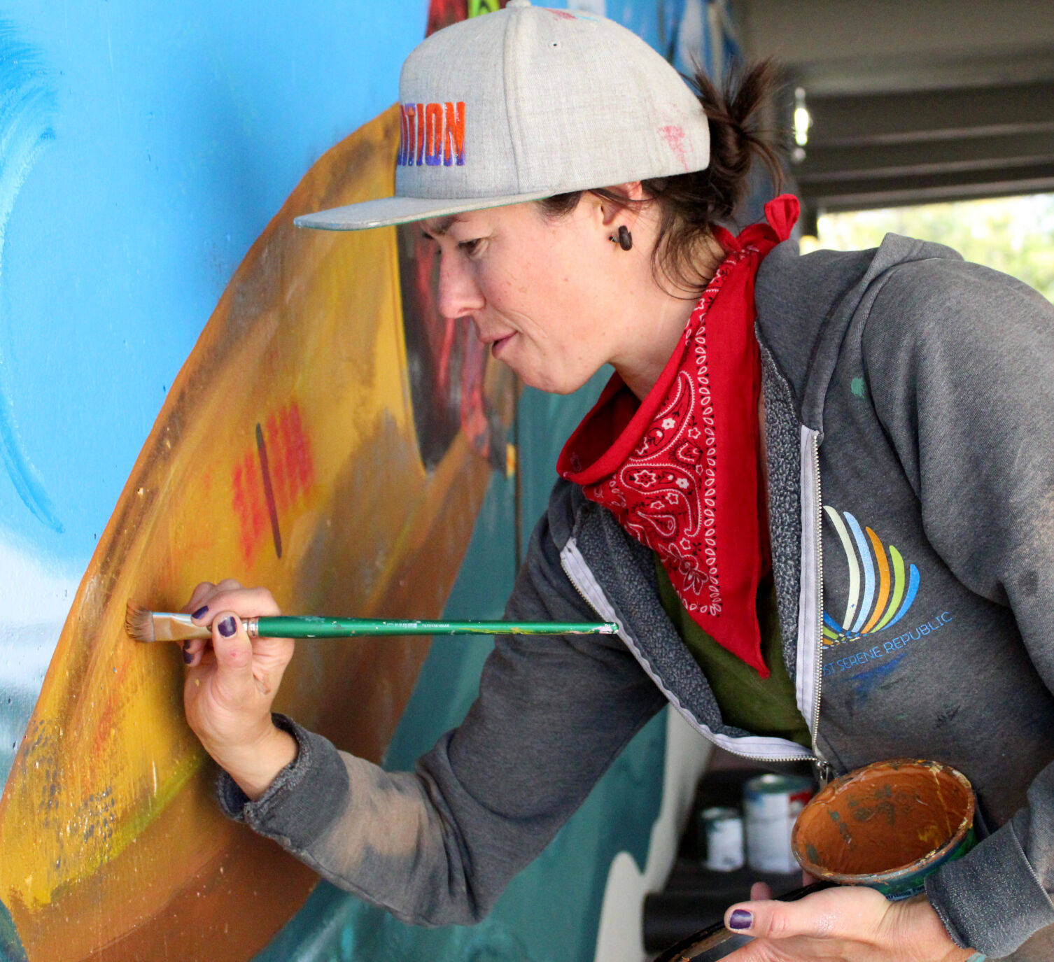 Heather paints kayak with metallic